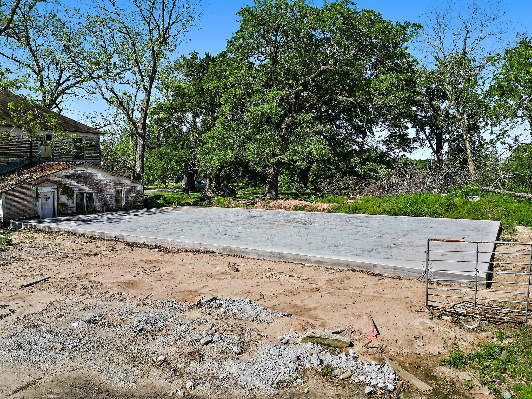 406 Main Street Winnie, TX 77665 - Photo 16 of 20 a view of a backyard with wooden fence