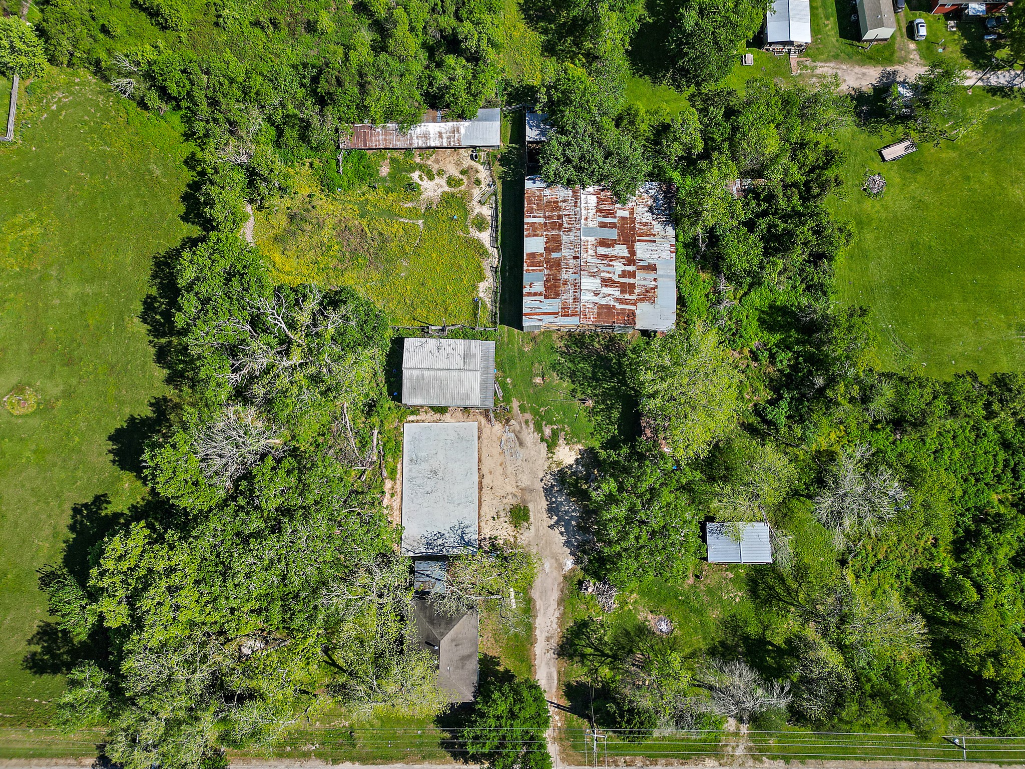 406 Main Street Winnie, TX 77665 - Photo 17 of 20 an aerial view of residential house with outdoor space and trees all around