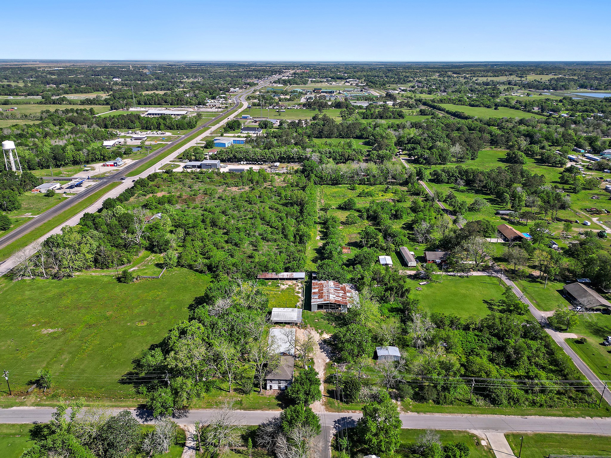 406 Main Street Winnie, TX 77665 - Photo 18 of 20 an aerial view of residential houses with outdoor space and trees