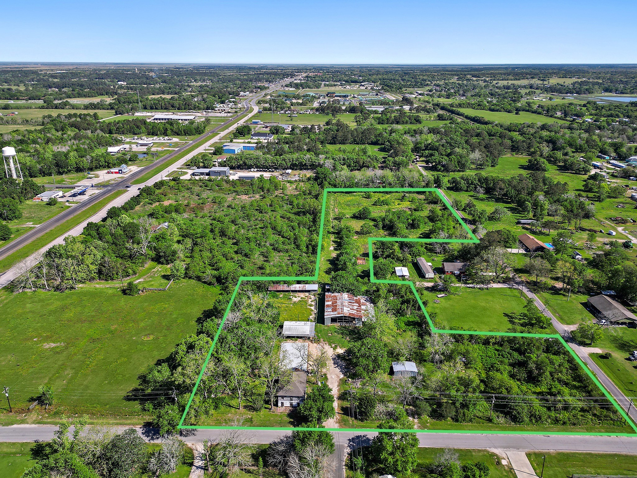 406 Main Street Winnie, TX 77665 - Photo 2 of 20 an aerial view of residential houses with outdoor space and trees