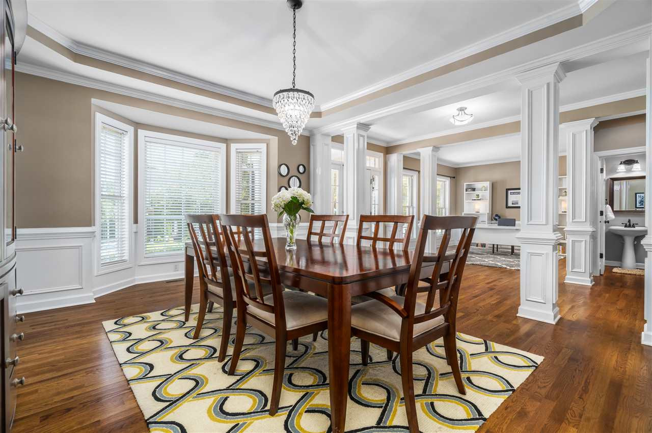 1520 Wood Spring Court Raleigh, NC 27614 - Photo 8 of 30 Formal dining room with tray ceiling and gorgeous decorative trim details, bay window and lots of natural light. Site finished hardwood floors Dining Room