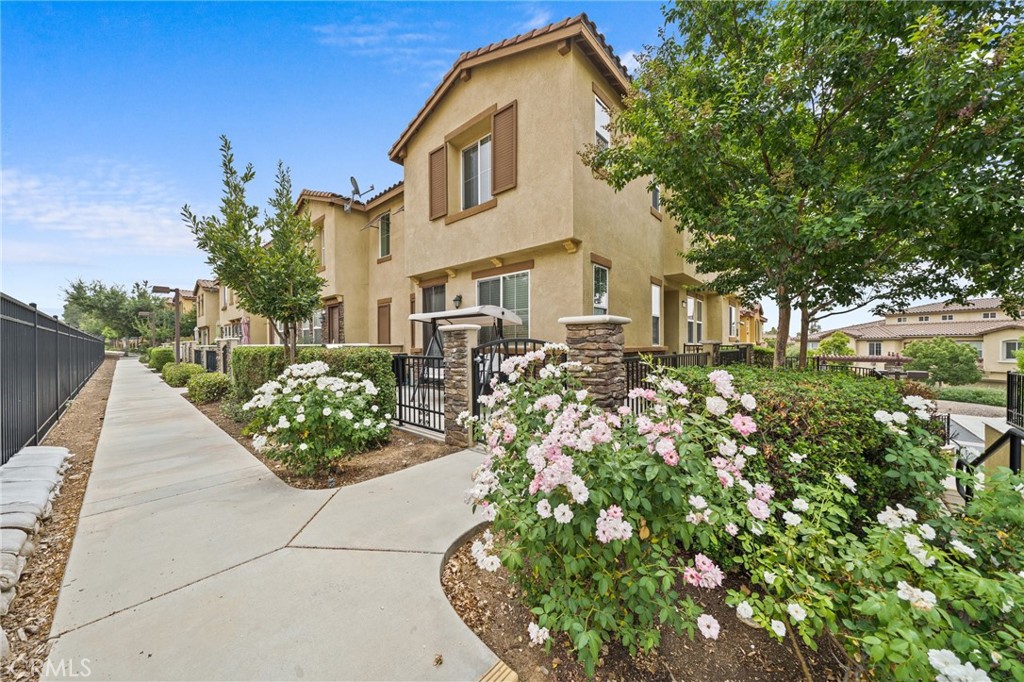 8064 Cresta Bella Road Rancho Cucamonga, CA 91730 - Photo 1 of 1 a front view of a house with a yard