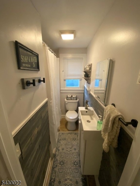 3 Plane Street Stanhope, NJ 07874 - Photo 18 of 25 a bathroom with a toilet sink and mirror