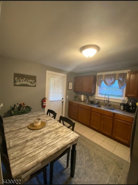 3 Plane Street Stanhope, NJ 07874 - Photo 9 of 25 a kitchen with stainless steel appliances granite countertop a kitchen island a stove a sink dishwasher and cabinets with wooden floor