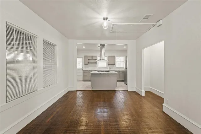 a view of a kitchen with wooden floor