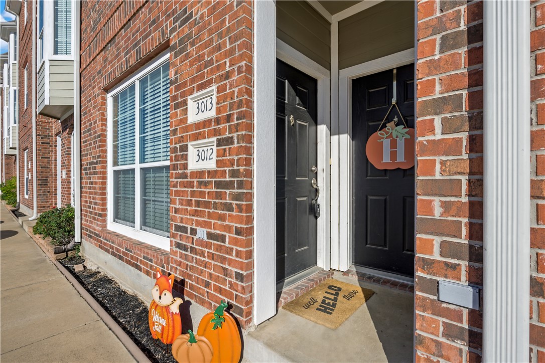 1198 Jones-Butler Road, Unit 2207 College Station, TX 77840 - Photo 2 of 14 a view of a brick wall with living room and a window