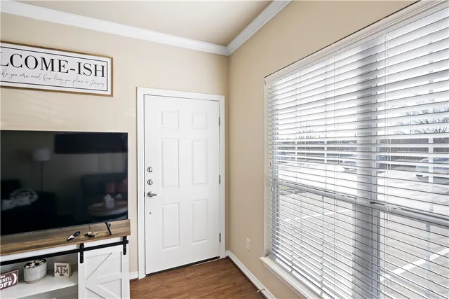 a view of front door with wooden floor