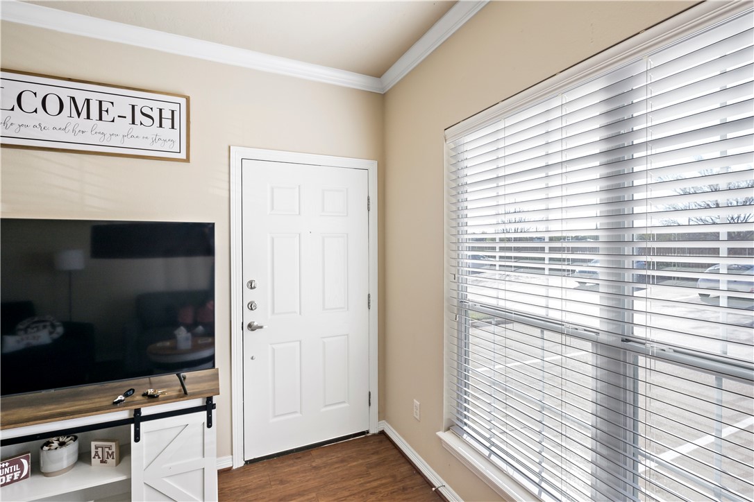 1198 Jones-Butler Road, Unit 2207 College Station, TX 77840 - Photo 3 of 14 a view of front door with wooden floor