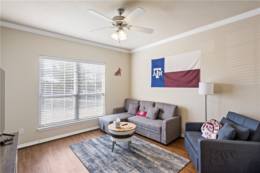 1198 Jones-Butler Road, Unit 2207 College Station, TX 77840 - Photo 5 of 14 a living room with furniture and a large window