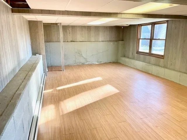 a view of wooden floor with windows in a room