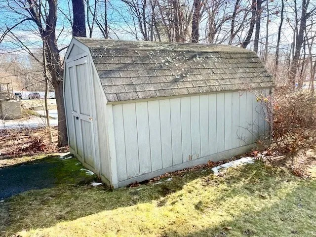 a view of a backyard of the house