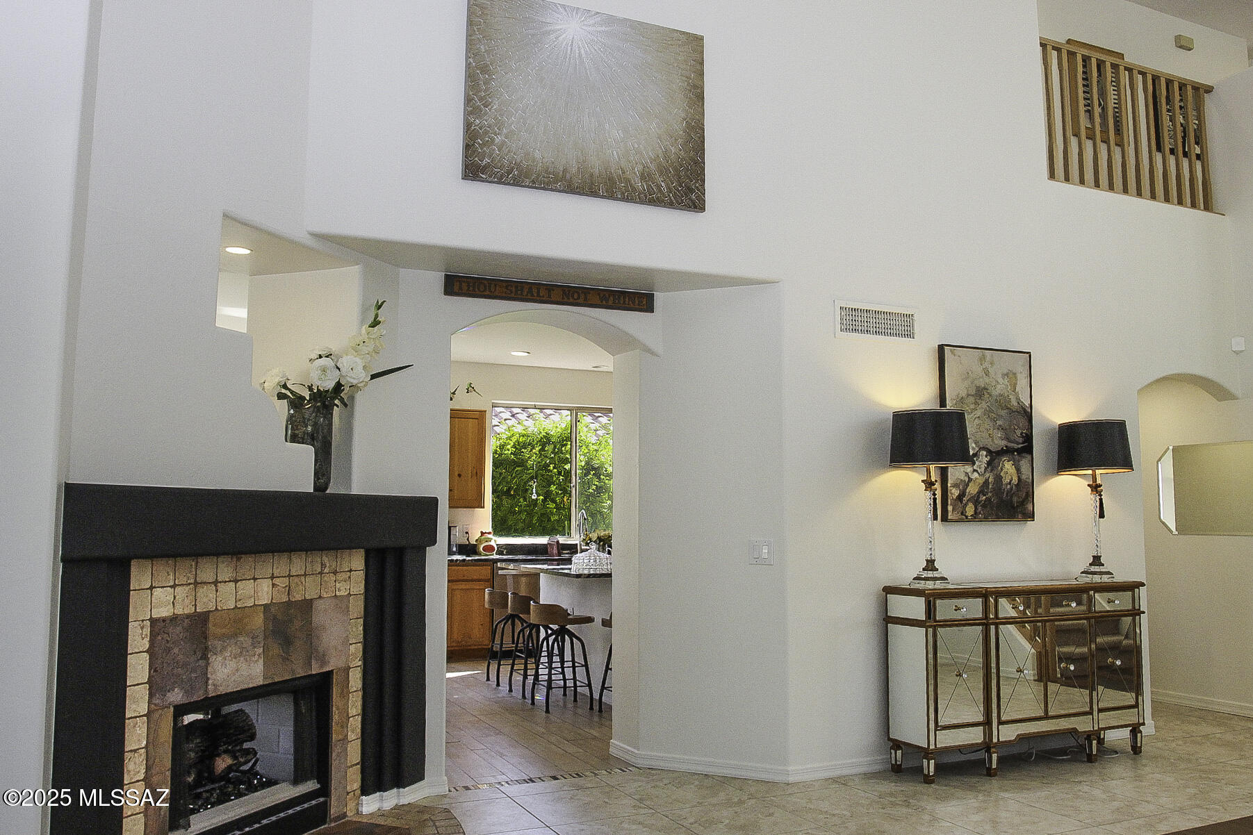 5202 Spring View Drive Tucson, AZ 85749 - Photo 12 of 49 a living room with furniture a fireplace and a table