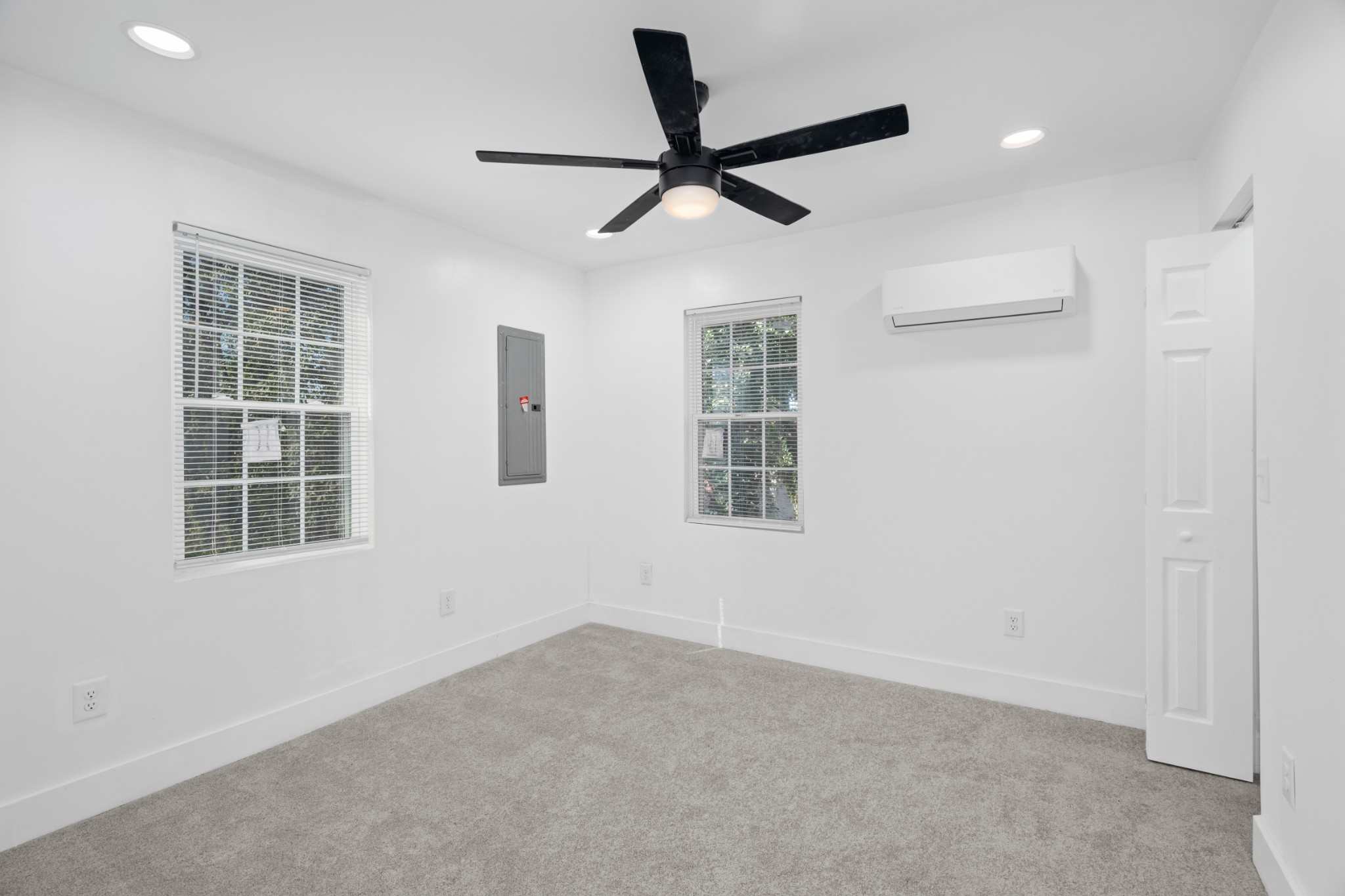 418 Jones Street Pulaski, TN 38478 - Photo 11 of 18 a view of a livingroom with a ceiling fan & windows