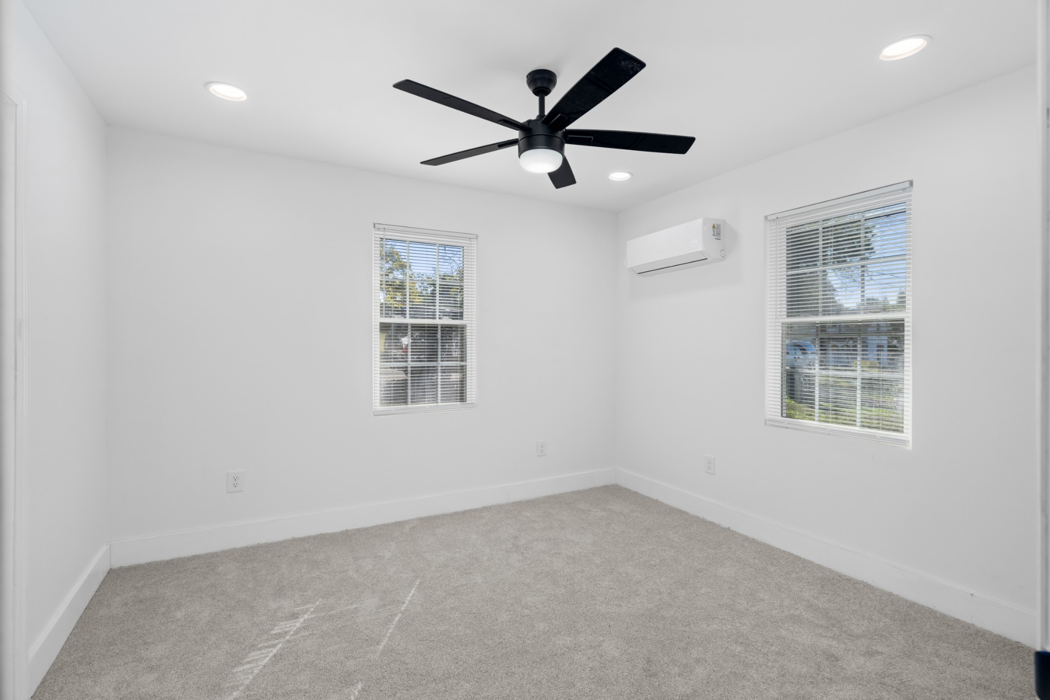 418 Jones Street Pulaski, TN 38478 - Photo 13 of 18 an empty room with ceiling fan and windows