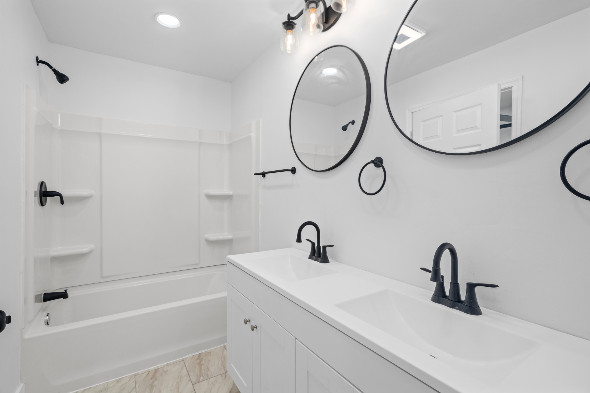418 Jones Street Pulaski, TN 38478 - Photo 16 of 18 a bathroom with a sink and a mirror