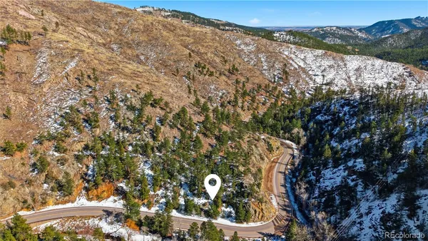 a backyard of a house with mountain view in back