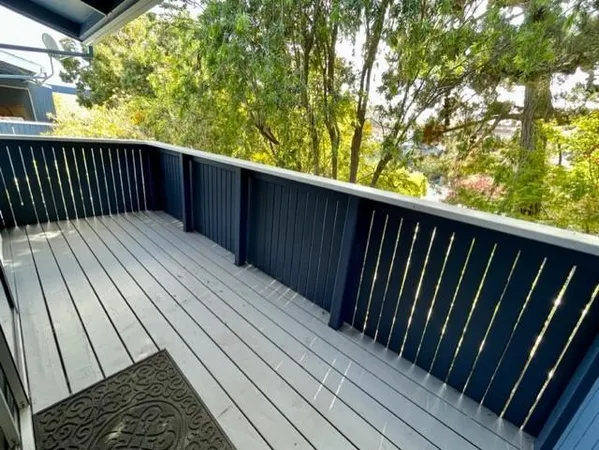 a balcony with wooden floor