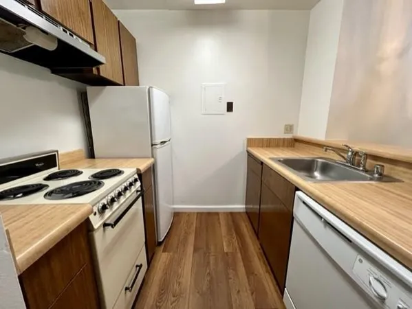 a kitchen with a stove and a sink