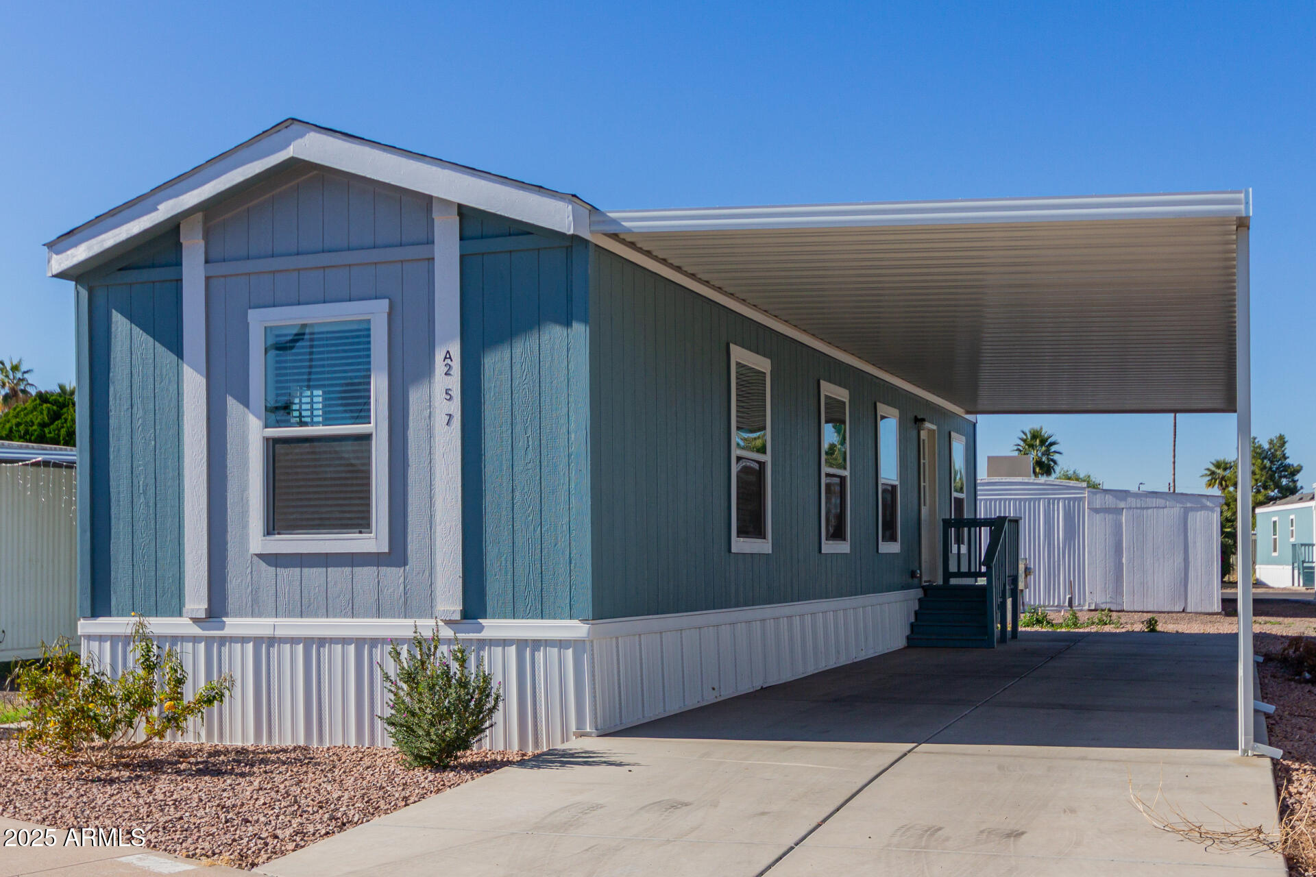 5201 West Camelback Road, Unit A257 Phoenix, AZ 85031 - Photo 2 of 13 a view of a house with a backyard