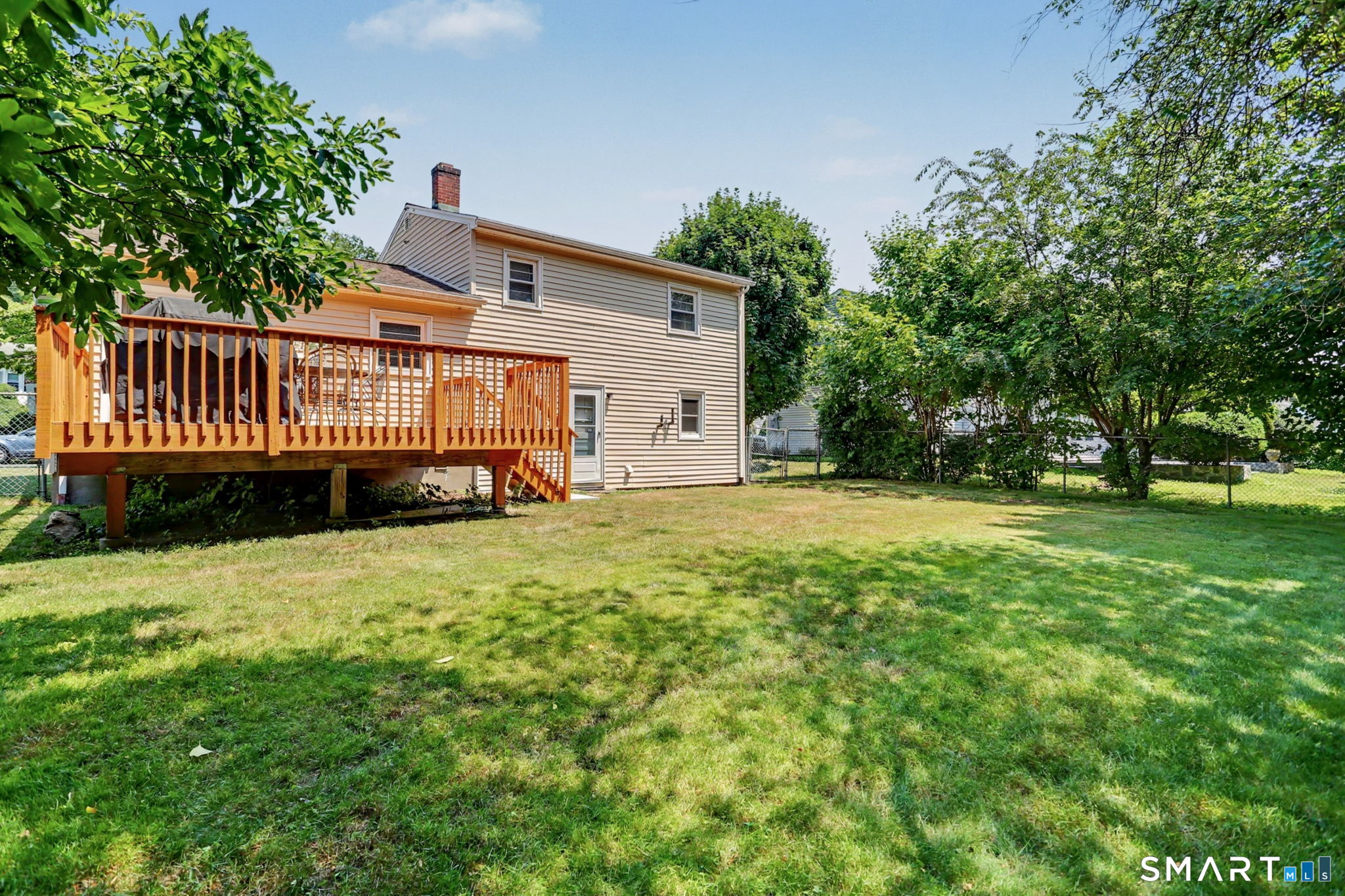 143 Ranch Drive Bridgeport, CT 06606 - Photo 26 of 32 Partial fencing in quiet backyard.