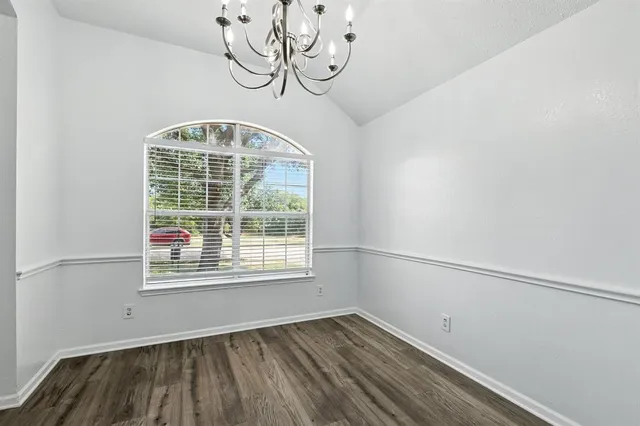 a view of a room with rack on the wall and a window