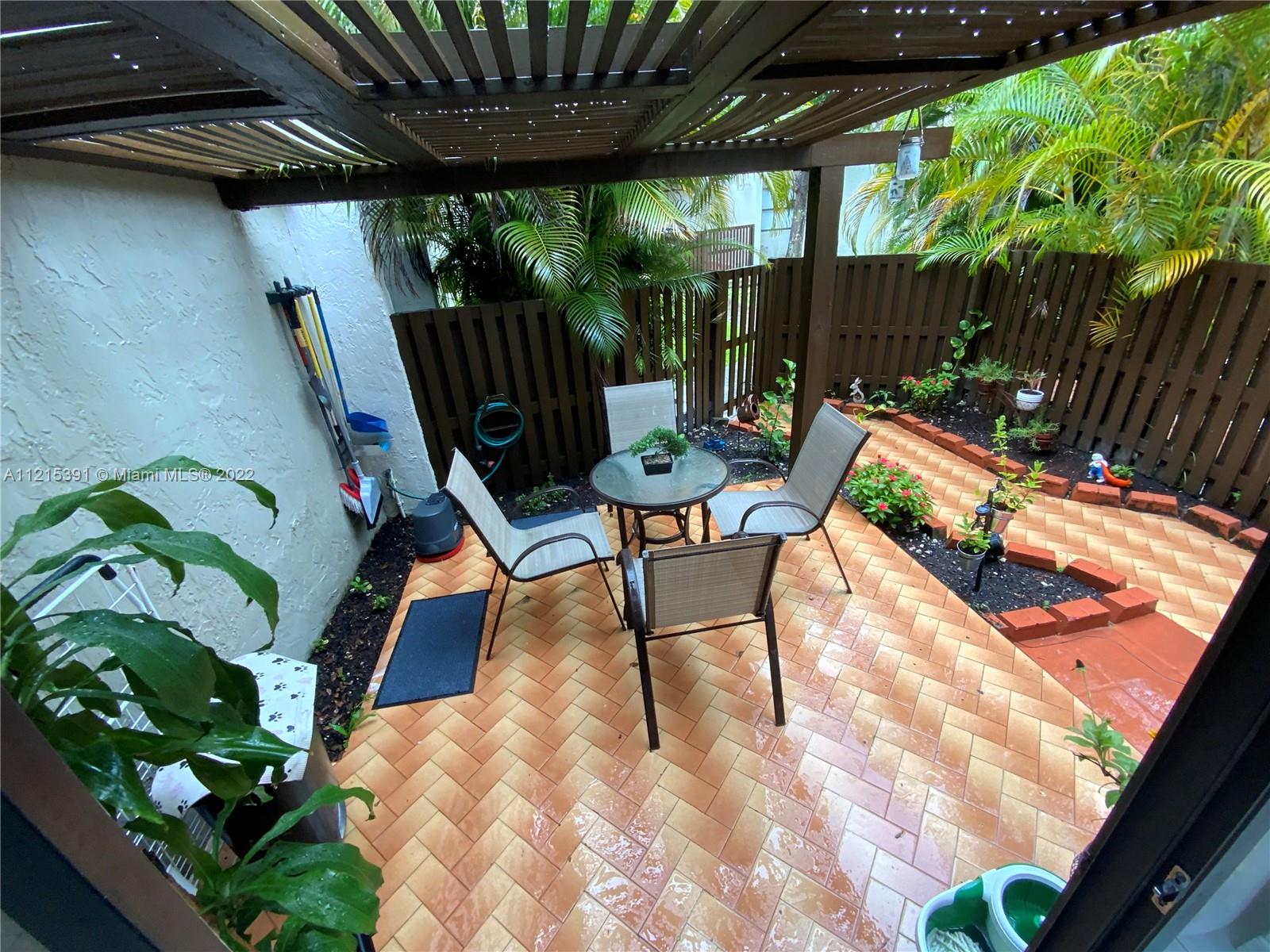 a view of yard with patio