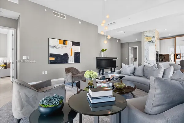 a living room with furniture and a flat screen tv