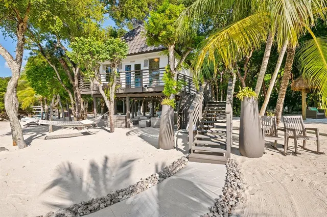 a bed room with a bed and a large window