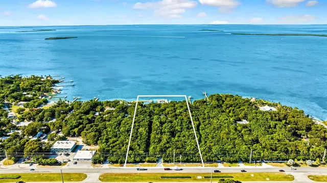 a wooden bench sitting in front of a building