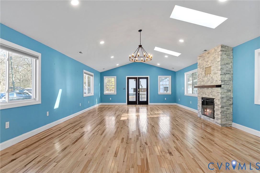 8059 Varina Road Henrico, VA 23231 - Photo 12 of 45 a view of an empty room with wooden floor and a window