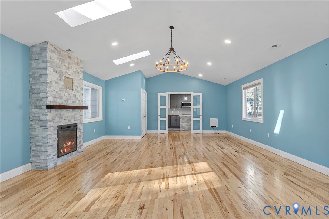 8059 Varina Road Henrico, VA 23231 - Photo 14 of 45 a view of empty room with wooden floor and fireplace