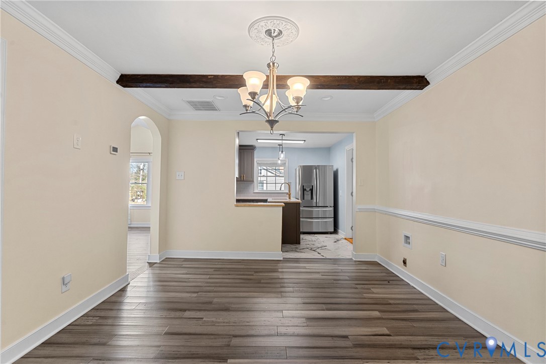 8059 Varina Road Henrico, VA 23231 - Photo 7 of 45 a view of a room with wooden floor chandelier and entryway