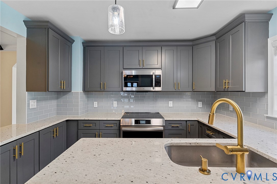 8059 Varina Road Henrico, VA 23231 - Photo 10 of 45 a kitchen with a sink a stove and cabinets