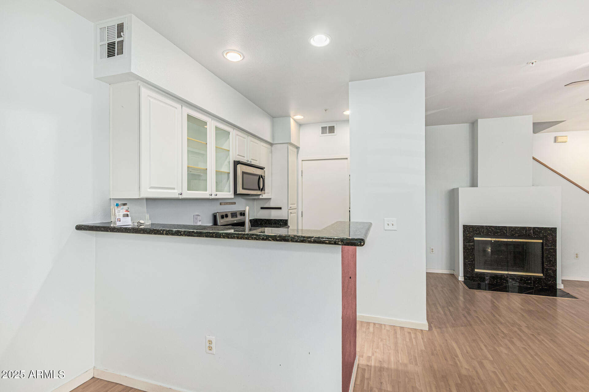 3633 North 3rd Avenue, Unit 2083 Phoenix, AZ 85013 - Photo 17 of 54 a kitchen with stainless steel appliances a stove top oven a sink and a refrigerator