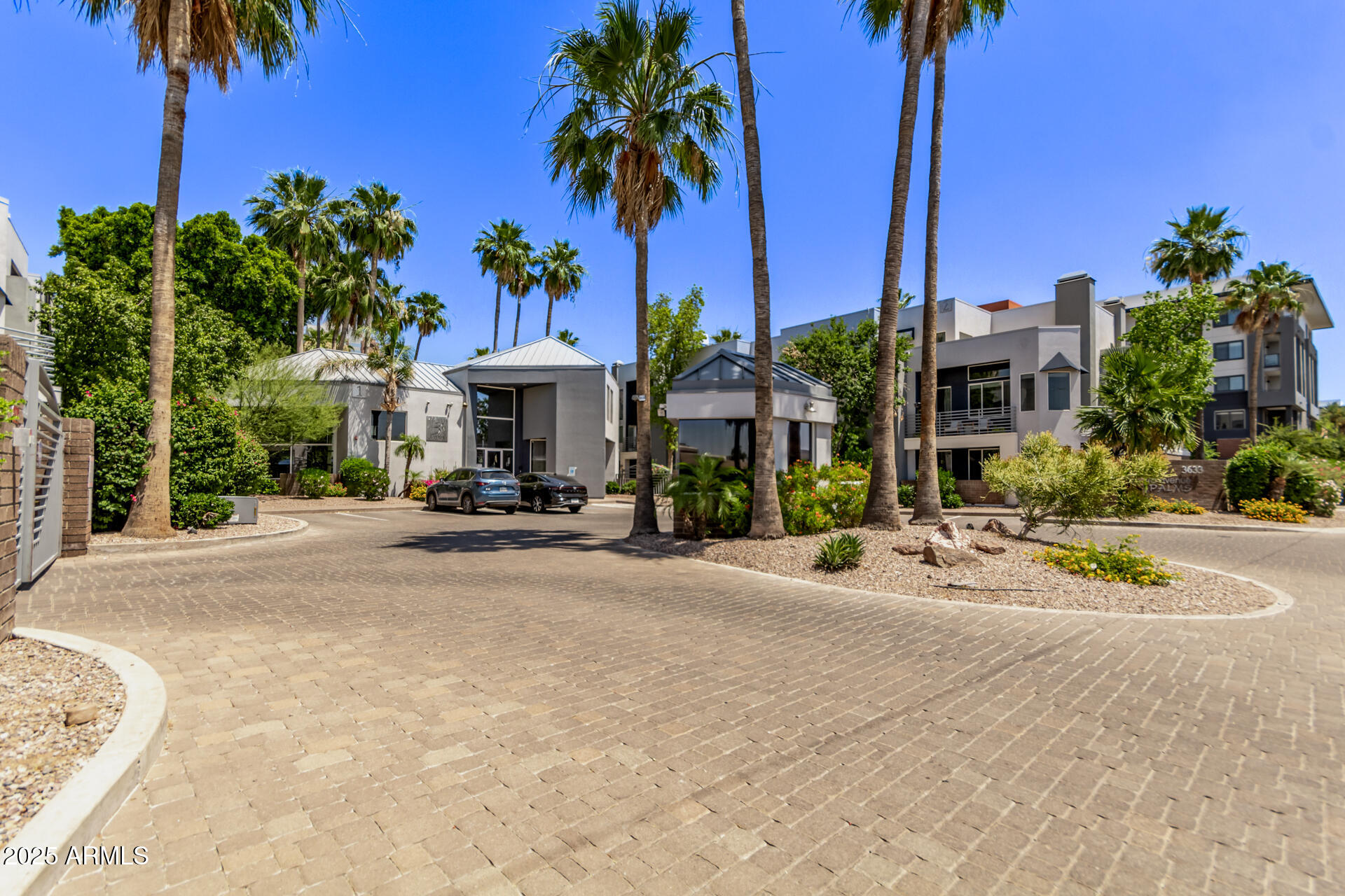 3633 North 3rd Avenue, Unit 2083 Phoenix, AZ 85013 - Photo 2 of 54 a view of a street with a cars park table and chairs