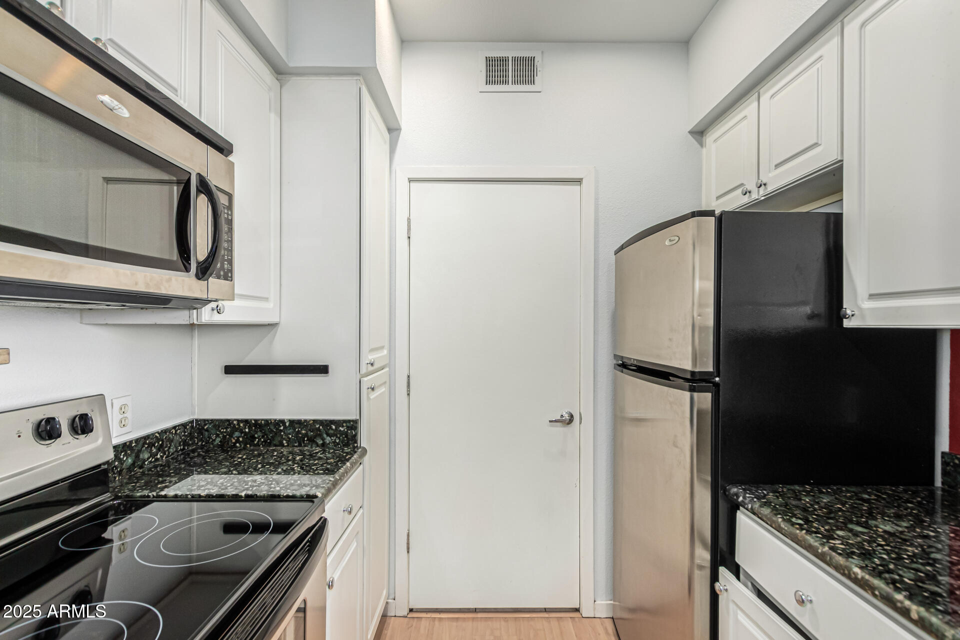 3633 North 3rd Avenue, Unit 2083 Phoenix, AZ 85013 - Photo 21 of 54 a kitchen with stainless steel appliances granite countertop a refrigerator and a stove