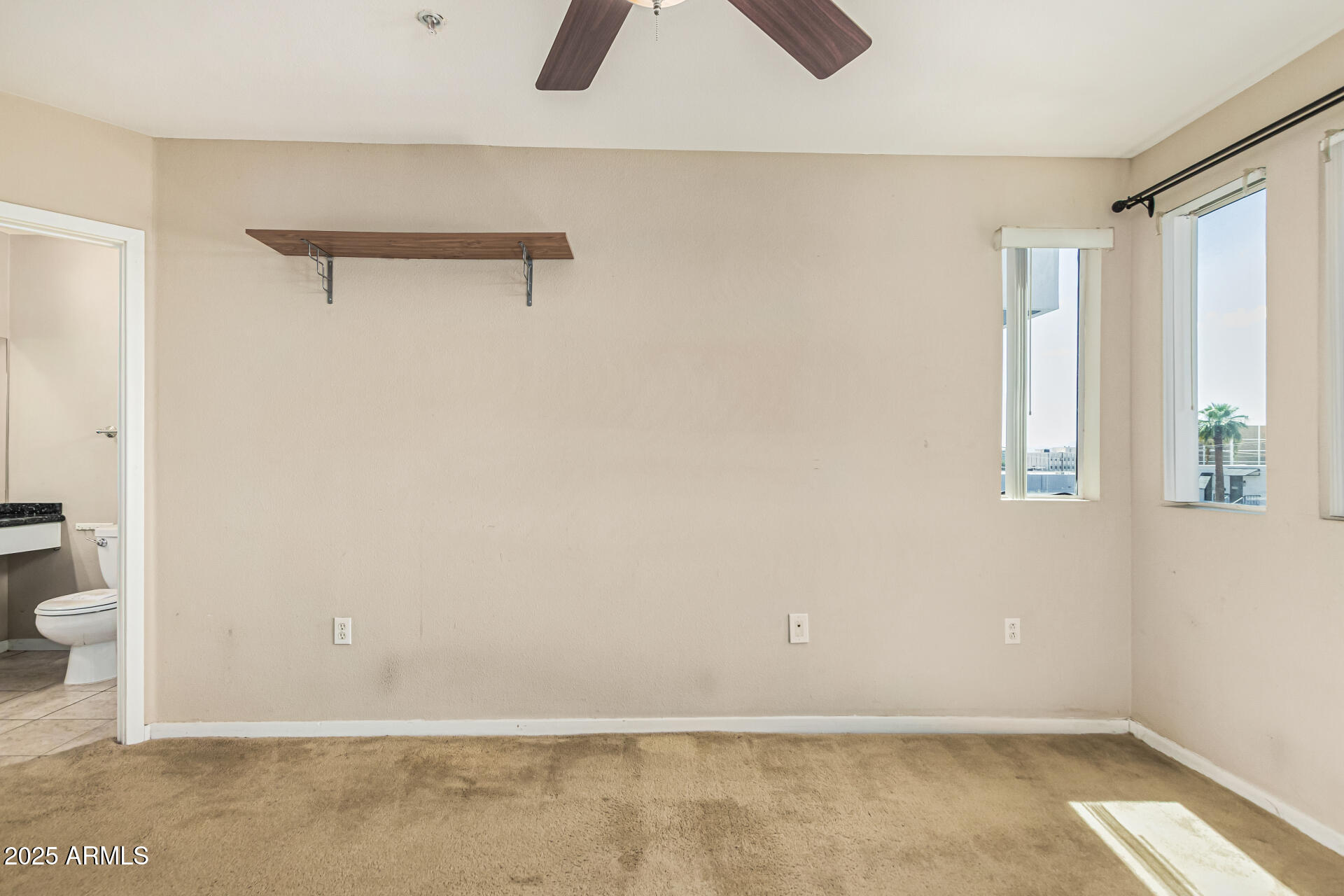 3633 North 3rd Avenue, Unit 2083 Phoenix, AZ 85013 - Photo 26 of 54 a view of a room with a wardrobe space