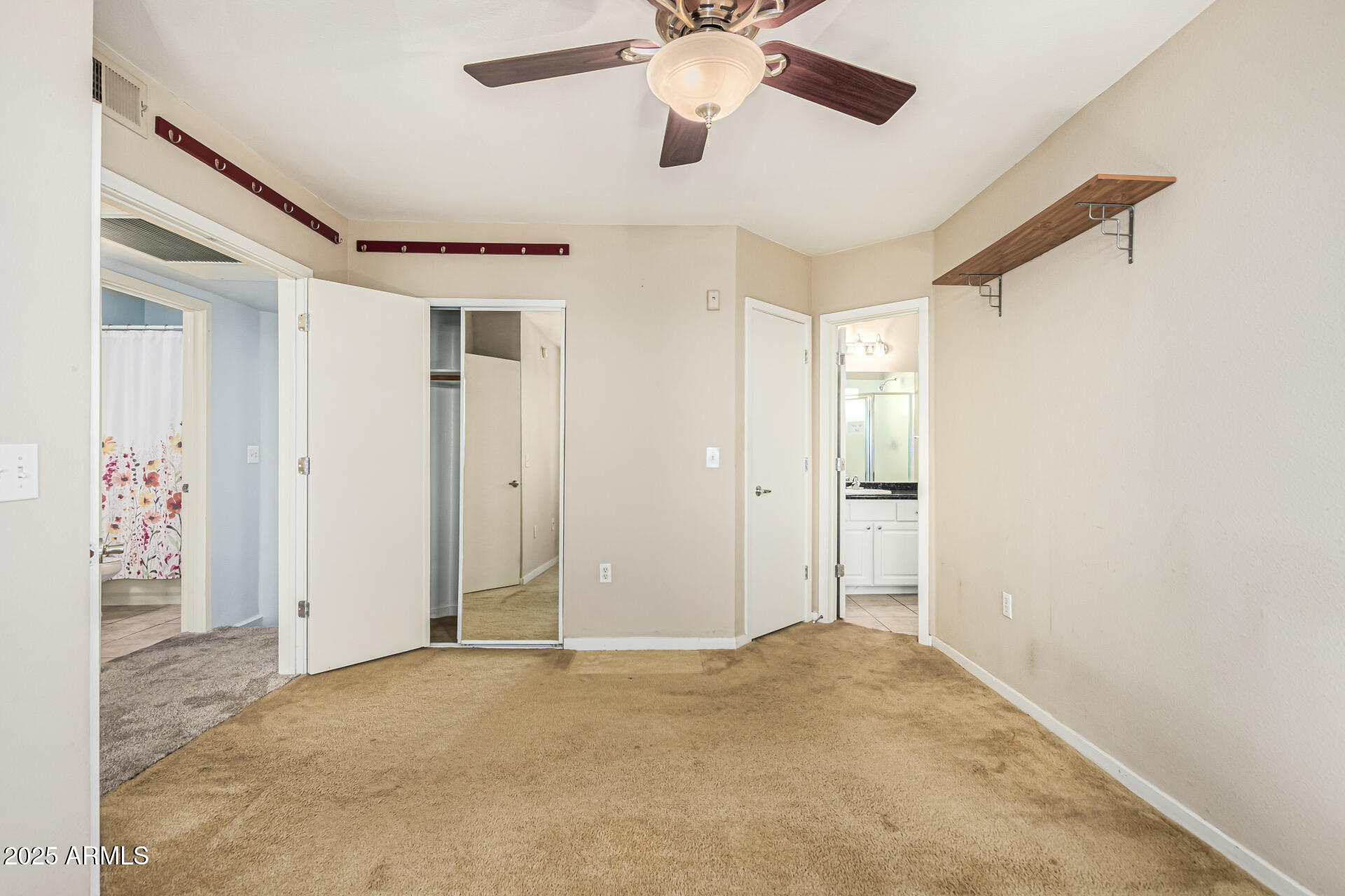 3633 North 3rd Avenue, Unit 2083 Phoenix, AZ 85013 - Photo 31 of 54 a view of a big room with closet and chandelier fan
