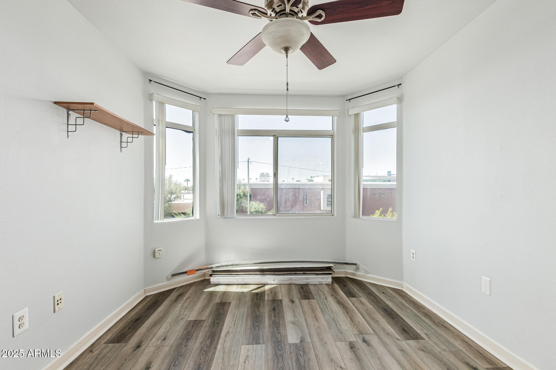 3633 North 3rd Avenue, Unit 2083 Phoenix, AZ 85013 - Photo 33 of 54 a view of an empty room with a window