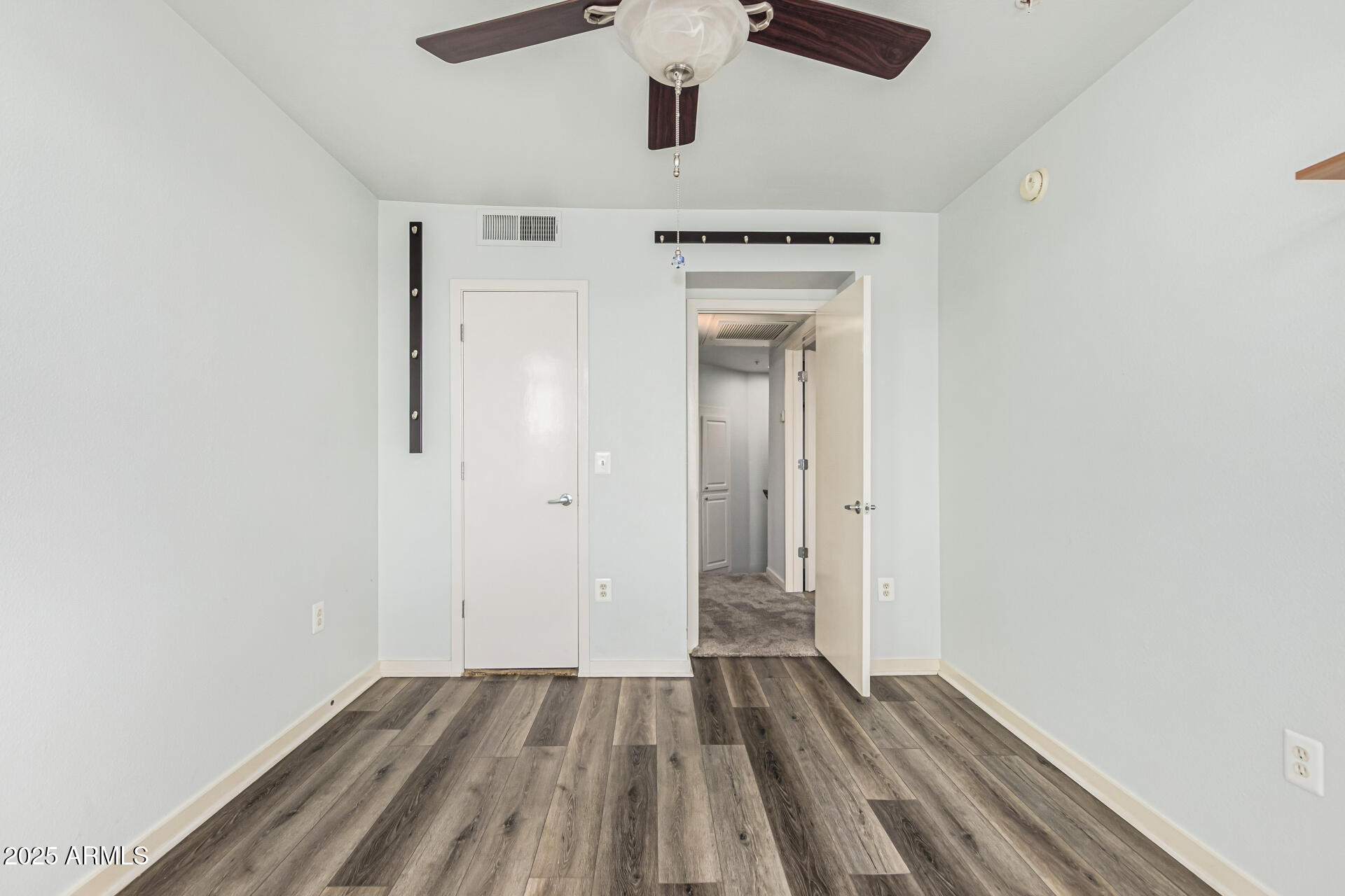 3633 North 3rd Avenue, Unit 2083 Phoenix, AZ 85013 - Photo 36 of 54 a view of empty room with wooden floor