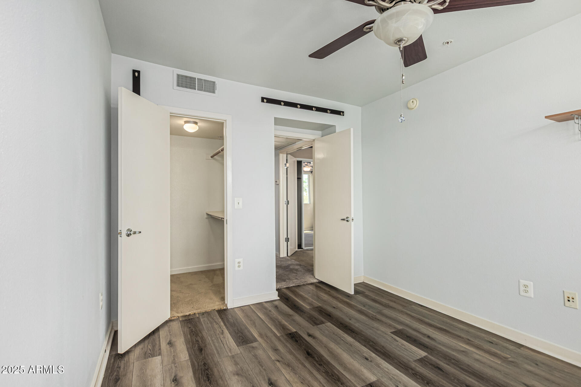 3633 North 3rd Avenue, Unit 2083 Phoenix, AZ 85013 - Photo 37 of 54 a view of empty room with wooden floor