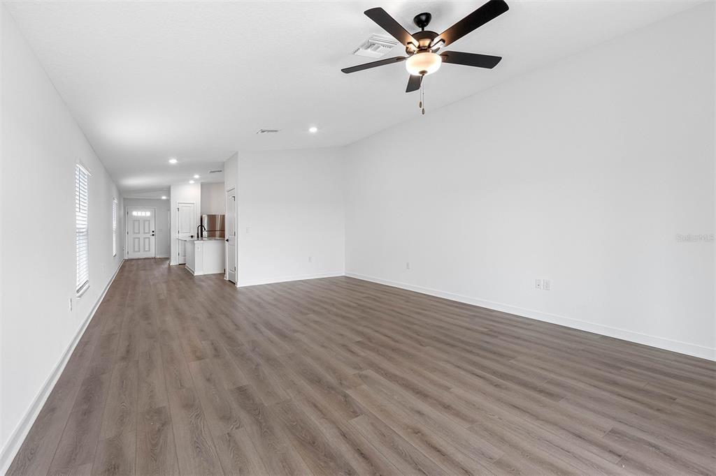 Undisclosed Address Lakeland, FL 33809 - Photo 4 of 7 a view of empty room with wooden floor