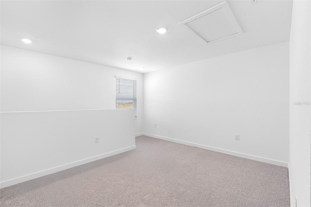 Undisclosed Address Lakeland, FL 33809 - Photo 6 of 7 an empty room with a empty space and windows