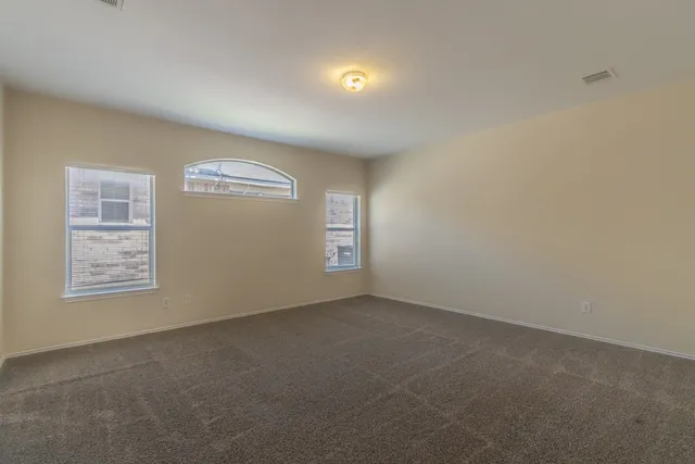 an empty room with windows