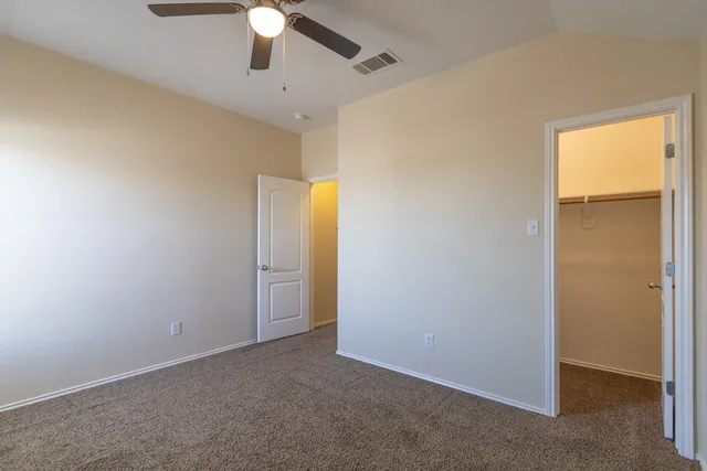 a view of a livingroom with a chandelier fan