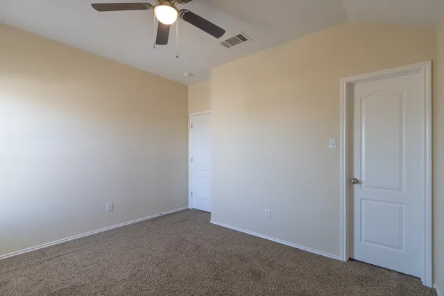 a view of a chandelier fan in a room