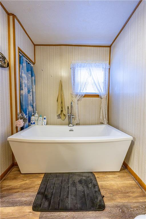 3318 Spring Garden Road Pittsburgh, PA 15212 - Photo 14 of 22 a bath tub sitting in a bathroom next to a window