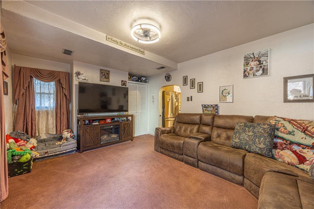 3318 Spring Garden Road Pittsburgh, PA 15212 - Photo 3 of 22 a living room with furniture and a flat screen tv