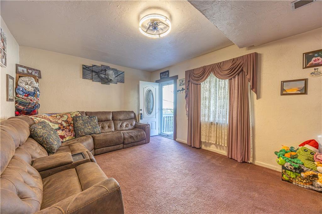 3318 Spring Garden Road Pittsburgh, PA 15212 - Photo 4 of 22 a living room with furniture and a large window