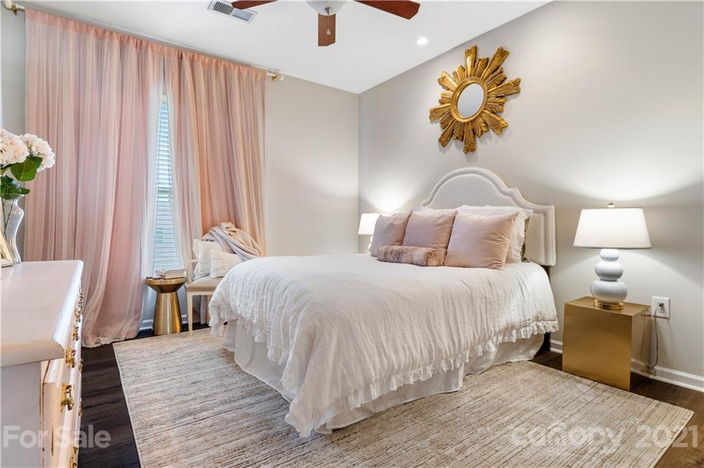 1433 Camden Road Charlotte, NC 28203 - Photo 11 of 22 a bedroom with a bed and wooden floor